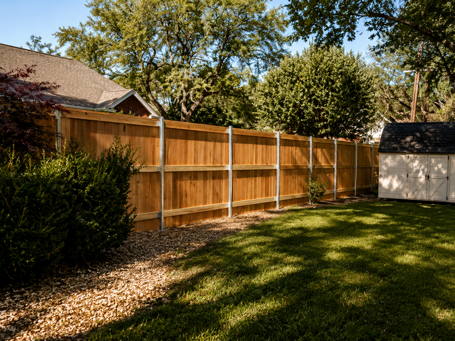 Completed fence defining a residential yard